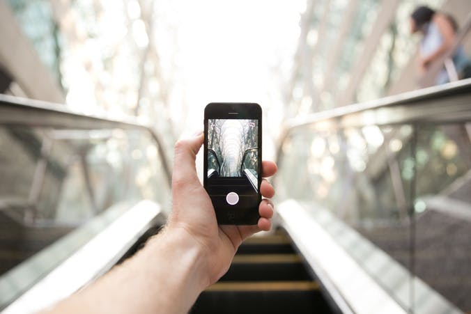 escalator, a video hand and phone
