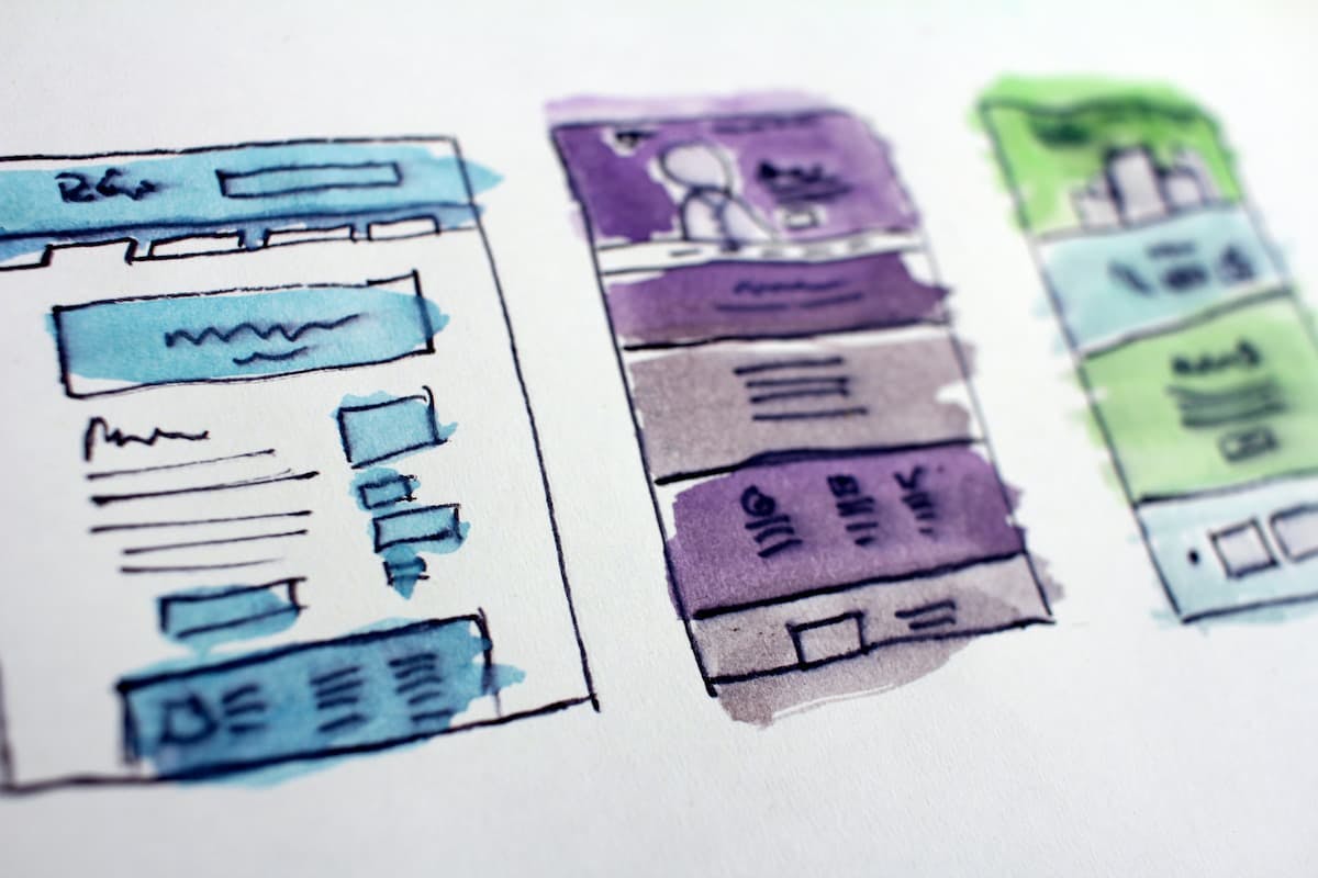 a wireframe with watercolor paint of a website
